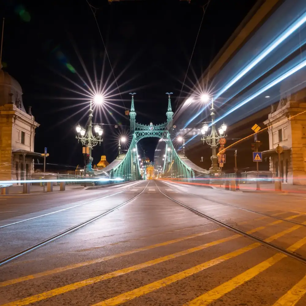 Liberty Bridge in Budapest in the evening time, long exposure with lights from the traffic, horizontal